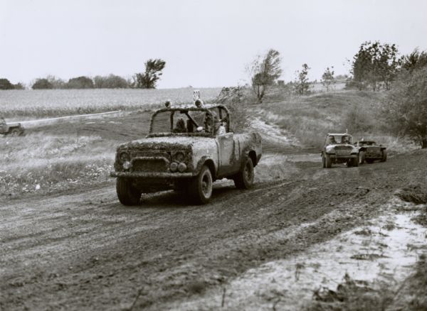 Original caption reads: "Off-road racing is becoming an increasingly popular sport as the numbers of sports/utility vehicle owners grow. The International Scout SS-II, introduced in 1977, has proven to be a favorite vehicle with off-road racers. Recent Scout SS-II victories include the Class III SCORE World Championship Races at Riverside, CA, and the four-wheel drive production class at the Baja 1000 in Mexico.  The Scout SS-II pictured was competing in a recent race near Lake Geneva, WI, and is included in the International Scout exhibit at the Chicago Boat, Sports and RV Show, January 4-8, McCormick Place.  1/4/78."