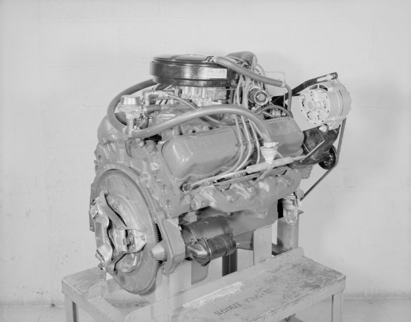 Scout Engine displayed on a metal or wood stand, with the words: "Scout Engine" painted on the top.