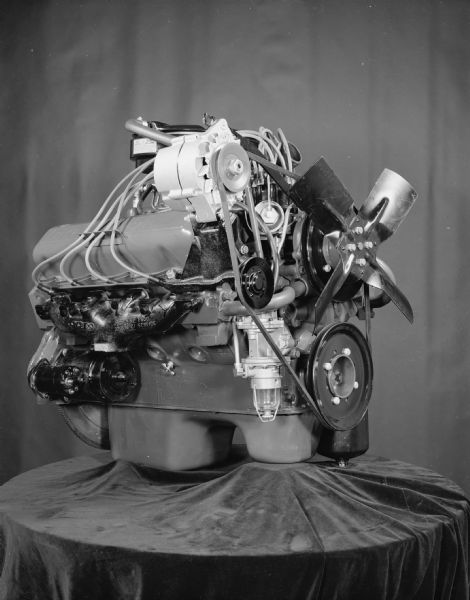Scout engine displayed on a table draped with fabric.