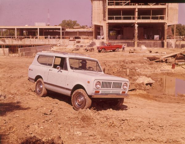 Man driving Scout II at job site.