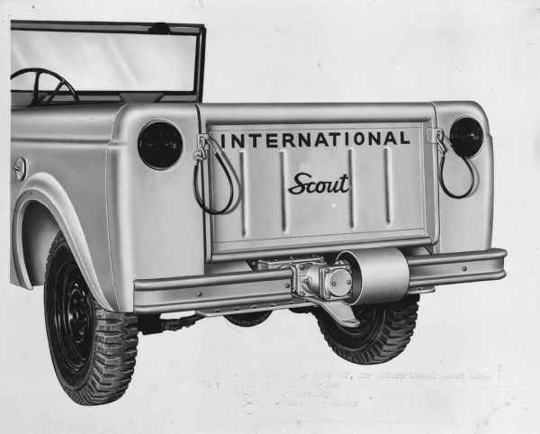Three-quarter view from rear of equipment mounted on the open tailgate of a Scout 4x4. Image appears to be retouched.