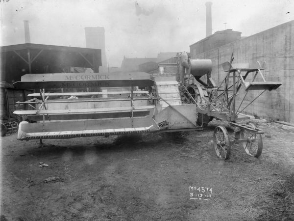 Original caption reads: "McCormick No. 2 harvester-thresher. This model first built in 1916 was designed along lines similar to the Deering harvester-threshers and was the first McCormick-built machine to use the straw walker-type of separating mechanism. The McCormick No. 2 had a double cleaning shoe with two cleaning fans, and was chain driven from the main wheel. Cutting width 9 feet. This machine was sold domestic as well as foreign."