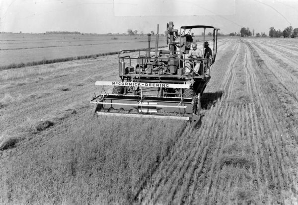 McCormick-Deering 17w self propelled combine harvesting flax.