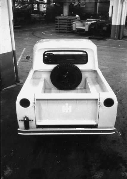 Slightly elevated rear view of a 1961 International Scout, including spare tire and IH logo. Subject of an article in <i>International Harvester Today</i> entitled: "The Scout."