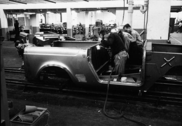 Fort Wayne employees welding the body of an International Scout. Assembly line image from International Harvester's Fort Wayne plant, subject of a 1961 article in <i>International Harvester Today</i> entitled: "The Scout."