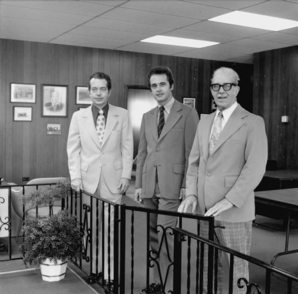 Three Kickert employees posing in office.