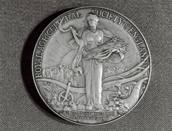 Caption on back: "The silver medal of the Royal Agricultural Society of England, which has been awarded to IH at the Royal Show 1981, for the innovative design of the Axial-Flow combine.