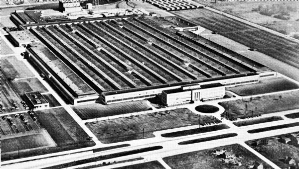 Original caption reads: "Melrose Park Works, Melrose Park, Illinois demonstrates the Company's belief in Chicago and its future. This huge plant, formerly used for the manufacture of aircraft engines, was purchased by Harvester and occupied early in 1946. It consists of about 135 acres of ground, a modern administration building, and approximately 1,500,000 square feet of manufacturing space under roof. Melrose Park Works is now headquarters of the Industrial Power division and is one of three plants of that division- the others are Tractor Works, Chicago, and Milwaukee Works, Milwaukee, Wisconsin- building heavy-duty engines, power units, and tractors for industrial purposes. It is located west of Chicago, at the intersection of North Avenue and U.S. Route 45. A full line of heavy-duty engines and power units is being produced at Melrose Park Works. In the near future large-scale production is expected to start on a new crawler tractor weighing 35,000 pounds. Present employment is about 3,800 with employment set at about 5,000 persons when the plant is in full production."