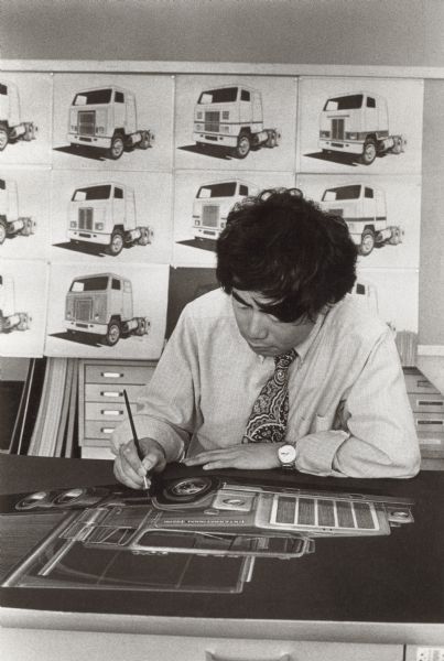 Industrial designer putting finishing touches on photograph of proposal for 1970 F4370 Transtar Highway Tractor Truck.