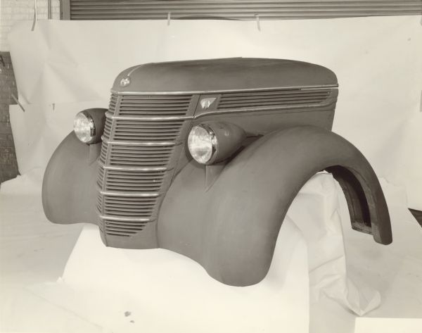 Clay mock-up of front end of D-30 for 1937 model year. Left front view, note wood frame for fenders.