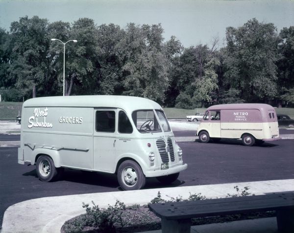 The Model on the left is a S-150, and painted on the side is: "West Suburban Grocers." The model on the right is a two-tone S-120, and painted on the side is: "Metro Parcel Service."