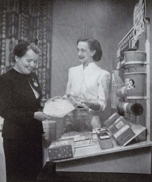 Miss Helen Rogers and Miss Bower discussing Irma Harding packaging materials.