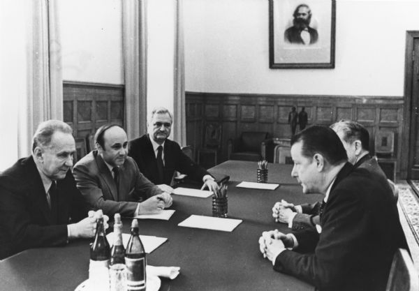Brooks McCormick, (right), president and CEO of International Harvester, chatting with Alexi Kosygin, (left), Premier, USSR, during Mr. McCormick's recent trip to the Soviet Union. Joining in the discussion were V.N. Sushkov (left, background), member of the Board of Mniitry of Foreigh Trade, U.S.S.R. and Robert J. McMenamin, (right, background), vice president, Special Operations, Overseas Division, and a Russian translator.