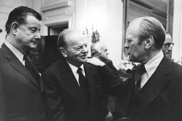 Brooks McCormick, on the left, unidentified man in center, and President Ford on the right. Brooks McCormick was attending a reception for the Business Council at the White House.
