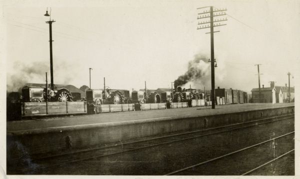 A rail load containing five McCormick-Deering 10-20 tractors, New Zealand.  