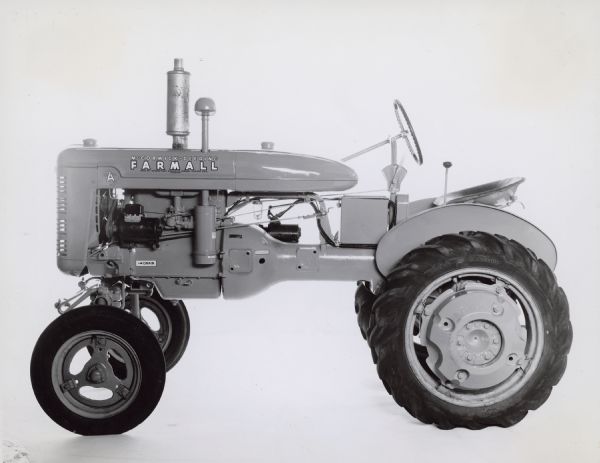 Left side profile view of Farmall A tractor with starting attachment.