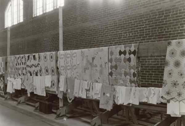 Quilts on display at Benham. Benham, Kentucky was a "company town" created by International Harvester for the workers employed in the mines of its subsidiary, the Wisconsin Steel Company.