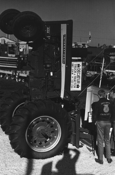 Slightly elevated view of an International 826 Tractor sitting on it's rear wheels facing up. From a series highlighting IH's display at the Illinois State Fair.