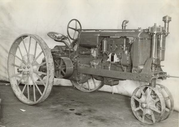 Three-quarter view from right front of an experimental F-21 Farmall Tractor. Original caption reads: "Title- F-21 Farmall Tractor. neg no. GP 11209. Mar. 1-36.  View showing right hand front complete tractor 3 3/4 x5 engine.  Job no. 52517. q-no 3125 to 3133 incl. Weight 4100 lbs."