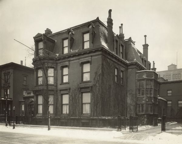 Exterior view of Cyrus McCormick Jr's home at 50 E Huron Street.  Original caption reads: "Frank S Fulton, Photographer. Jan 1929. 50 E Huron St, Chicago-southeast view."