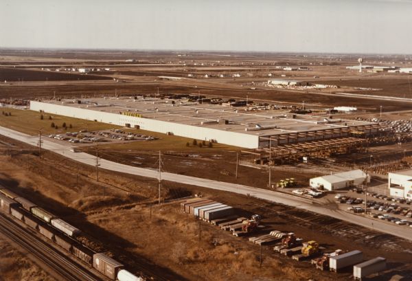 Elevated view of Steiger factory buildings. In the foreground are railroad cars on railroad tracks.