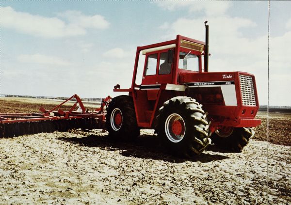 Brochure with a photograph of an International Turbo 4186 tractor in a field.