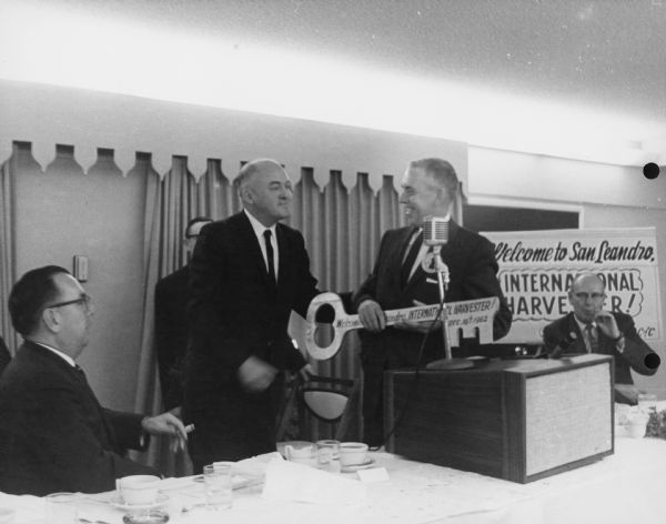 Men at the head table at the luncheon at the Edgewater Inn Hotel. Caption on back reads: "Mayor Jack Maltester (mayor of San Leandro) presents key to the City to J. W. Zimmerman".
