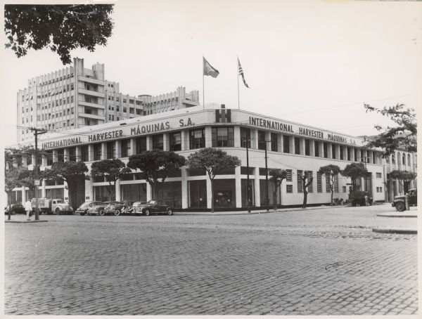 Exterior view of the Rio de Janeiro Branch House. The sign on the building reads: "International Harvester Máquinas S.A." Handwritten on back of photograph: "I.H. Building, Ar. Barão de Tefé 74 Rio de Janeiro."