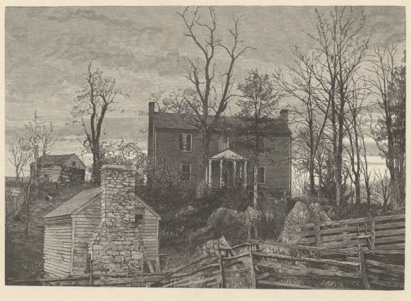 View looking up towards the manor house on a hill at the Walnut Grove farm. In the foreground below are fences and a small building with an external chimney. Trees, bushes and large rocks are on the hill leading up to the house, and a stream issues from below the rocks. A small building in disrepair is above a fence and gate in the left background on the hill near the house.