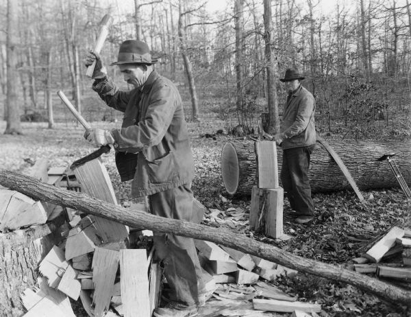 Handwritten on back: "3. Man at right is cutting off sap wood. R. Man at left is using a frow (knife) to split block into thinner sections."