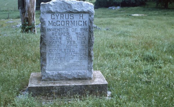 Stone marker at Walnut Grove. The inscription reads: "Cycrus H. McCormick — Inventor of the reaper. Was born on this farm, Feb. 15, 1809. Here he completed the first practical reaper in 1831." At bottom: "V.P.I. Student Branch of American Society of Agricultural Engineers 1928."