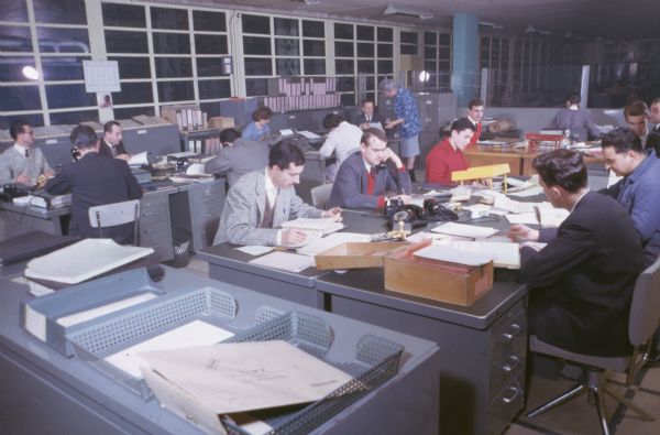 Men and women are working in an office.