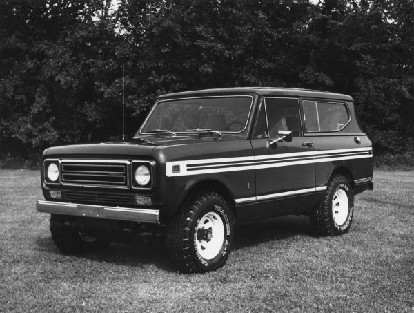 Advertising photograph of the International Scout II truck. This model is described as a sports/utility vehicle with engine choices of a four-cylinder and two V8 engines plus a six-cylinder diesel engine. News Photo sheet reads: "The 1979 International Scout II continues its reputation as a rugged versatile sport/utility vehicle. New interior trims and an extensive list of optional equipment and accessories are offered. Scout engine choices include a four-cylinder and two V8 engines plus a six-cylinder diesel engine."