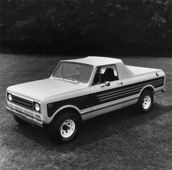 Advertising photograph of the International Scout Terra. News Photo sheet reads: "The optional dealier-installed Suntanner package transforms the 1979 International Scout Terra pickup into a convertible. The Terra offers 11 cubic feet of in-cab storage space plus a full six-ft. bed."
