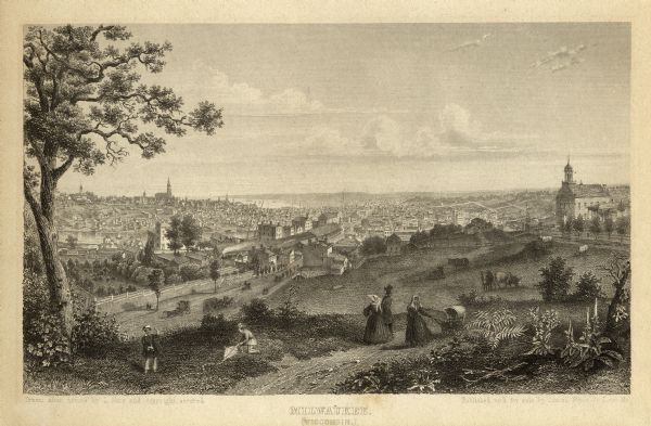 Elevated view from bluff looking down on city, with Lake Michigan in background. Detailed foreground with two boys playing with a grounded kite, while a man and woman stand looking at the city with their backs to viewer; to their right a woman is pushing a baby carriage. Horses race by just below the bluff, with steam trains, houses, and other buildings below. Sailboats and steamships ply the harbor, and several churches are visible on the hills. Titled, copyrighted, and publishers name run along the bottom of the image.
