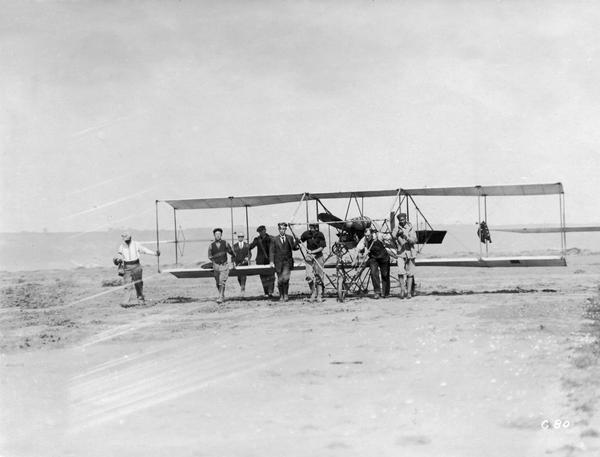 Students of the Curtiss School of Aviation on North Island moving a plane into position for a lesson.   