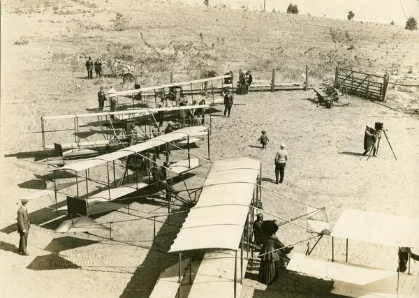 Photo opportunity day at the Glenn Curtiss School of Aviation on North Island in San Diego Harbor. The man in the lower left corner is thought to be Glenn Curtiss himself.