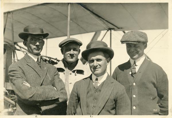 Pilot Glenn Martin (left), visiting the Curtiss aviation school, with Curtiss aviators (left to right) John McClaskey and Lincoln Beachey, and with mechanic Henry Kleckler.