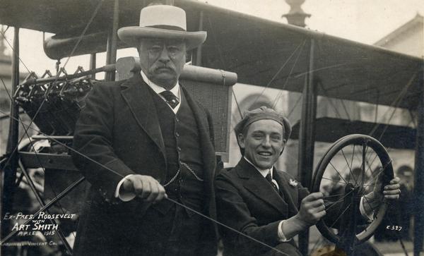 Former President Theodore Roosevelt with pilot Art Smith and his Curtiss Pusher at the Panama Pacific International Exposition.
