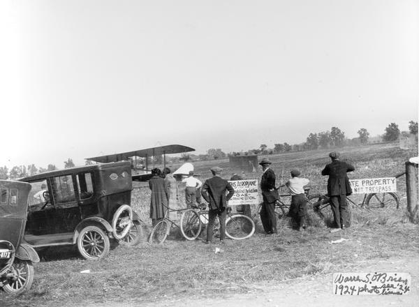 A barnstorming pilot and curious onlookers at a field on the outskirts of Waukesha that served as a primitive airport. Technically, the term barnstorming should be applied to the flying of the 1920s, while the flying of the pre-World War I flying is properly referred to as exhibition flying. The term "barnstormer" refers to the pilots who took to the air after World War I in cheap, surplus military planes.  In rural areas, barnstormers often landed by necessity in farm fields, attracting local attention by flying low. Barnstormers made their living by giving rides to the locals and performing acrobatic stunts.