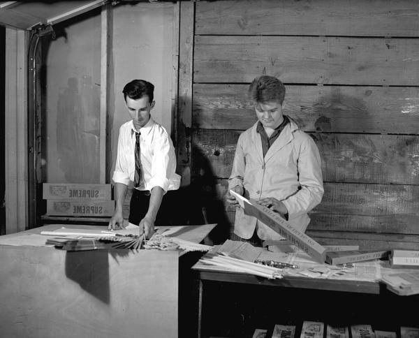 Assembly line packing by the Supreme Model Supply Co., a model airplane company started by Waukesha teenagers in 1940.
