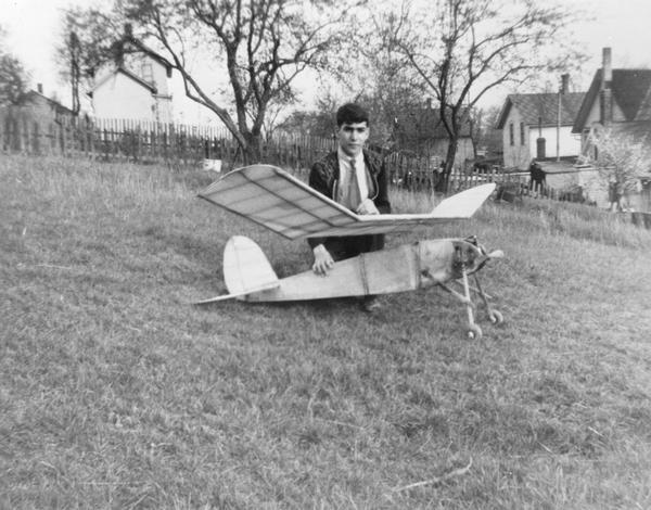 Tony Italiano of Waukesha, founder of the Supreme Model Supply Co., with a large model airplane.