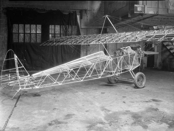 Ray and Carl Breecher's Heath parasol monoplane while still under construction in their father's garage. Despite extensive modification, the plane crashed during a test flight in 1934. The E.B. Heath Airplane Company of Chicago was established to make airplanes affordable. The company sold the best known of the build-your-own airplanes. Customers could buy complete kits, plans, or parts.