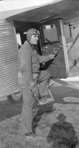 Commercial pilot C.B. "Cash" Chamberlain posed with a Hamilton Metalplane owned by Universal Airlines. Chamberlain began his flying career with the Walter Liskowitz airline company of Waukesha. Later, he flew as a test pilot for the Hamilton Metalplane Company in Milwaukee and for Universal Airlines. When Northwest Airways purchased nine Hamilton planes Chamberlain went along as part of the deal. Chamberlain died in a plane crash in Montana in 1939.