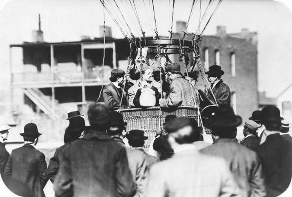 A balloon about to ascend in Minneapolis. John Schwister, who later built the Minnesota-Badger airplane, is in the front of the gondola, with his back to the camera. The man is thought to be Walter Wellman.