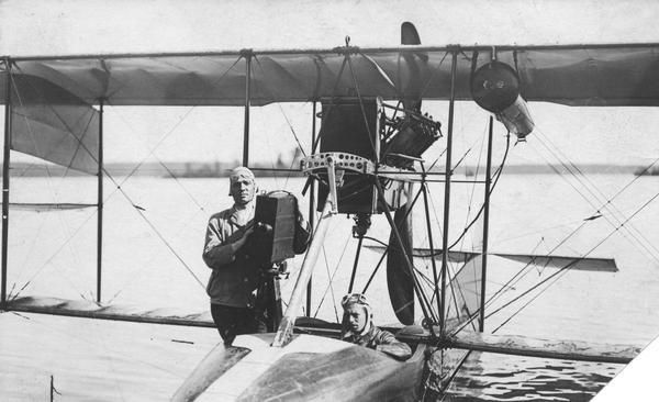 Jack Vilas (seated) in the Curtiss hydroplane he used to spot forest fires for the Wisconsin Conservation Department. (His companion is not identified.) This is believed to be the first use of an airplane for conservation work.