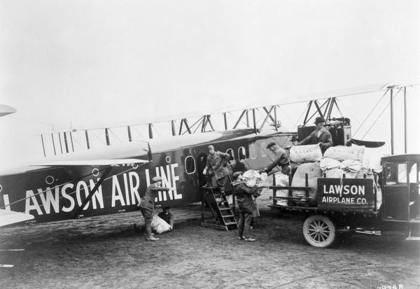 The completed Lawson L-4, the second and larger airplane designed and built by Alfred Lawson in Milwaukee in 1920. Not only was Lawson's airliner intended to carry 34 passengers, but he planned for the aircraft to carry 3 tons of mail. The mail was to be transferred through a chute to a small plane flying below so that the Lawson plane would not have to land at all cities.