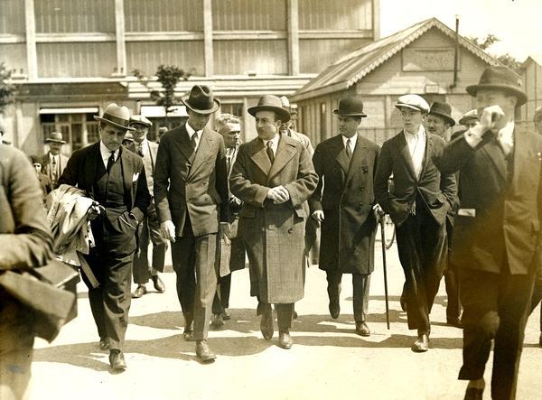 Lindbergh after his arrival in Paris on an inspection tour of Le Bourget airport. The man on Lindbergh's left with whom he is chatting is the British aviator, Sir Alan Cobham. Over Lindy's left shoulder (without a hat) is journalist Leland Stowe, whose papers are housed in the Wisconsin Historical Society Archives. Stowe was covering the Lindbergh story for the New York Herald Tribune.