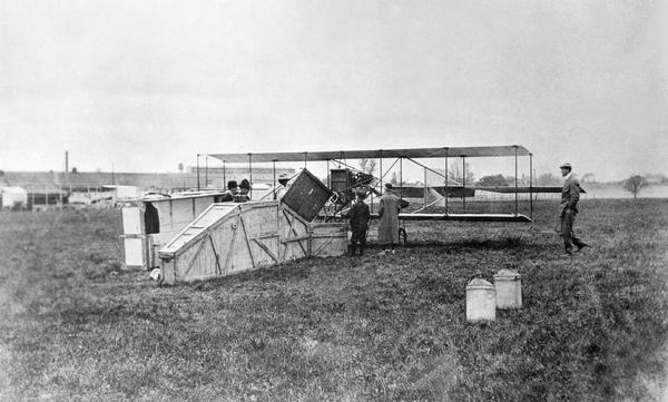 Lincoln Beachey's Curtiss Pusher and the crates in which the airplane was transported by rail to the Sheboygan fairgrounds. At the time, Lincoln Beachey was the best and most famous American aviator. 
Limitations on the range of early planes and uncertain landing conditions meant that all pilots traveled with crated airplanes to the exhibition circuit.