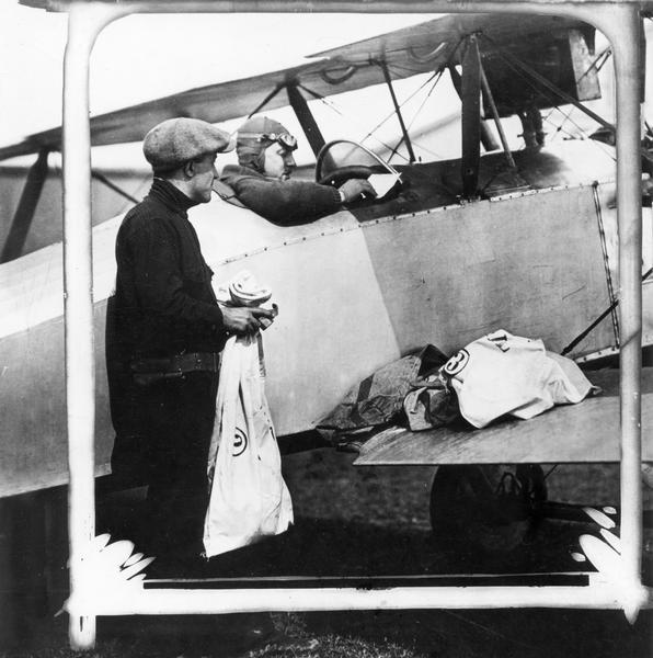 Commercial pilot Dave Behnke, who later headed Airline Pilots Association, signing for a load of airmail. After service as a pilot during World War I, Behnke, a native of Cambria, worked for a number of airlines that served the Chicago-Minneapolis routes. Concerned about the safety conditions he experienced and the salaries of  commercial pilots, Behnke became a leader in organizing the Airline Pilots' Association (ALPA) in 1932. Dave Behnke served as ALPA president until 1951.